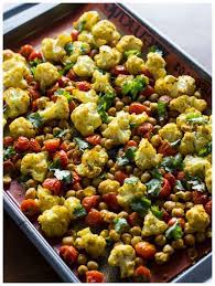 Roasted Cauliflower Tomatoes Chickpeas W Indian Spices Recipe Veggie Dishes Indian Food Recipes Healthy Holiday Side Dishes