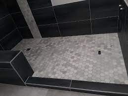 Wow Look At Those Marble Hex S They Give Such A Nice Pop Up Against Those Dark Tiles This Is A Really Nice Design Tiles For Less Dark Tile Really Cool Stuff