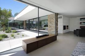 Einfamilienhaus Pool Flachdach Steinfassade Panoramafenster Dachterrasse Fliesenboden Parkett Innenhof F Haus Architektur Architektur Architektur Haus