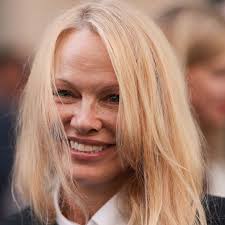 Pamela Anderson's country dress and boots combo just made our heads spin —  HELLO!