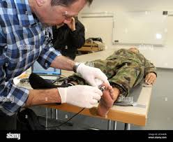 Physiologist Nils Bogerd L Of The Empa Swiss Federal Laboratories For Materials Science And Technology Uses A Sensor To Measure The Feet Of A Swiss Soldier At The Barracks Of The