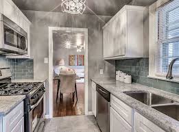 Beautiful Small Galley Kitchen With White Cabinets Juparana Delicatus Granite And Porcelain Galley Kitchen Design Small Galley Kitchens Kitchen Remodel Layout