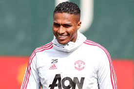 Antonio valencia (left) with eric bailly (centre) and paul pogba (right) after his final game for manchester united, against cardiff in may 2019. Hb7dubfnax68nm