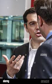 In this Thursday, March 17, 2016 photo, Palestinian clown doctor Alaa  Miqdad, center, gives 3-year-old Abdallah Saleem a balloon, in the  department of kidney diseases at Al-Rantisi children's hospital in Gaza  City.