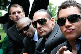 Keith Rhoades as Wikki, Chris Marsol as Percy Taylor, T-Bone as Martin De  LaFuente, and Michael Rivera as Chris Mayor