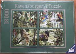 Challenge yourself with this 18000 piece puzzle, featuring exotic animals, such as elephants, giraffes, zebras, crocodiles, and lions gathering at a waterhole. 18000 Ravensburger Tropical Impressions Penfound Rare Puzzles