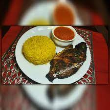 yellow rice with hot ghanaian pepper sauce and baked tilapia visit cultureandspices com for more