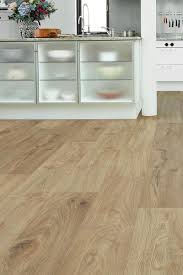 With A Rich Rustic Grain And A Warm Natural Oak Colourway Vantage Wood 14mm Laminate Flooring Beach Oak Comes Wood Laminate Flooring Flooring Kitchen Flooring