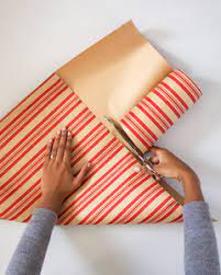Learn how to wrap presents and gifts without using tape or ribbon using basic origami principles. How To Wrap A Gift Without Tape Martha Stewart