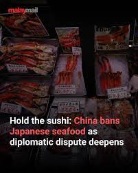 Malay - China informed Japan today that it will ban all imports of Japanese  seafood, media outlets reported — a decision which comes amid an escalating  diplomatic dispute between Asia's top two