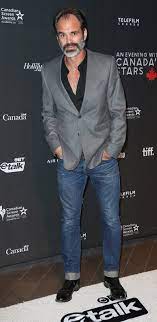 His father was a canadian while his mother was an english woman. Steven Ogg Height