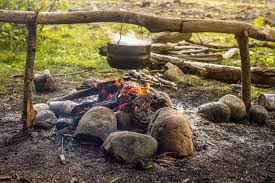 Place the first row of stones or bricks around the pit and bond them together with cement. How To Start A Campfire And Build A Fire Pit On Your Next Survival Trip