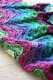 Crochet lace is one of the oldest forms of crochet, and recently it's gotten quite a revival as it's moved beyond the collar and doily. Lacy Ripple Blanket Crochet Pattern