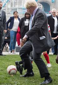 Boris Johnson Trips Nine Year Old Boy In Friendly Kick About Daily Mail Online When other like to kiss and hug kiss, instead he tackle a kid in a mini game rugby in tokyo.