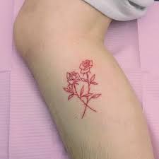 A large back tattoo that stretches across the shoulders. Small Two Red Crossed Roses Tattoo Red Tattoos Red Ink Tattoos Tattoos For Women