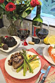 On the dinner plate between the surf and the turf, a baked russet potato with parsley butter. Irresistible Valentine S Meal For Two Filet Mignon Lobster Tail Sides Dessert Roses Katie S Cucina
