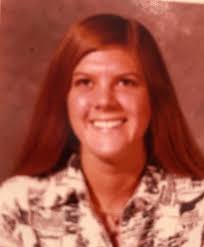 Adding 1978 graduate's name to the wall