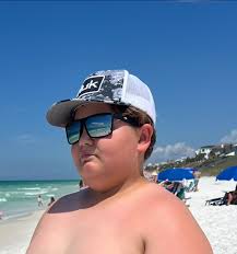 Lost black blackfin costa sunglasses in front of sea club