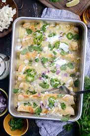 Add about 1/4 cup of the shredded cheese and roll up tightly. Cheesy Beef Enchiladas Verde Simply Scratch