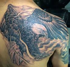Angry american eagle tattoo design. 50 Traditional Eagle Tattoos For Men 2021 Bald Rising Traditional Flag
