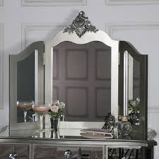Wood craftsmanship includes a beveled edge top, and a rectangle mirror that is surrounded by 13 brightly shining bulbs. Mirrored Dressing Table And Mirror Tiffany Range Melody Maison