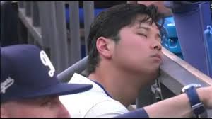 Ohtani sleeping in dugout vs Yankees.