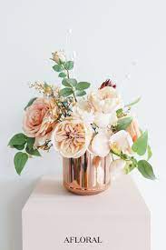 Faux flowers arrangements the foliage and flowers of houseplants add unmistakable living beauty to your indoor home decor. Simple Silk Flower Wedding Arrangements For Minimalist Brides Flower Decorations Flower Pots Fake Flowers