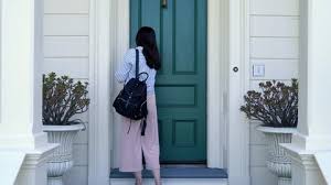 Asian Woman Leaving Home Work Locking