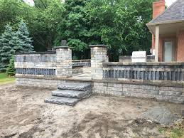 In most instances, if you're building a raised patio, you will be adding a substantial amount of fill material. Brick Paver Installation Oakland Twp Michigan Oakland Twp Mi Higher Ground Landscaping