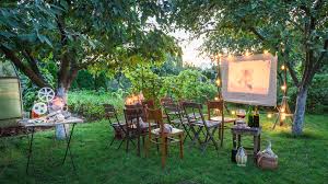 Buy an outdoor projector (you can find several under $100 online) and hang up a white sheet. Here S Everything You Ll Need For The Perfect Backyard Movie Night Review Geek