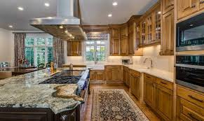 Styles include solid steel, metal and glass, and stainless with wood accents. How Much Do New Cabinets Cost Bkc Kitchen And Bath