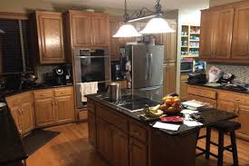 Kitchen updates i love that they did a dark stain with an antique. Eagan Oak Cabinet Painting Refinishing Project Okeefe Painting