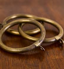 Antique gold colour, flat decorative curtain rod rings with plastic insert for 1 1/8 inch thick iron curtain poles / rods. Curtain Ring In Antique Brass Curtain Rings And Dog Collar Rings Curtain Poles The Collection Robert Kime Ltd
