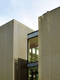 golden aluminium featuring cube patterns clads walls of university building by avdk decor10 blog facade architecture facade design facade house