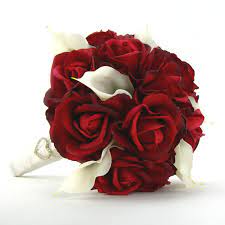 A bouquet of flowers from a lily, gerbera, white roses and alstroemeria on a white wooden table. Bridal Bouquet Red Roses White Calla Lilies By Timelesswedding 120 00 Red Bridal Bouquet Red Rose Bridal Bouquet Red Wedding Flowers