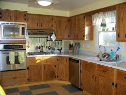 Diana S Early 60s Oak Kitchen With Plank Doors And Colonial Hardware Oak Kitchen Wood Floor Kitchen Best Flooring For Kitchen