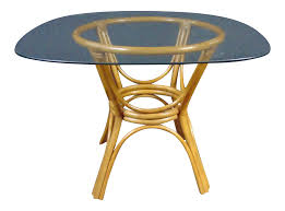 Designed in a curvy hourglass shape, it is finished in nero marquina marble, contrasted by it is accentuated by a brass ring on the center and features smoked glass top. Mid Century Rattan Glass Top Dining Table Chairish