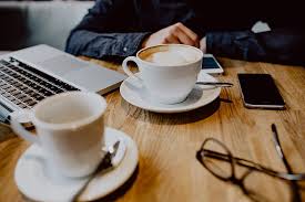The book start your own coffee and coffee processing covers. Hd Wallpaper Cup Of Coffee On Table In Cafe Interior Tech Technology Work Wallpaper Flare