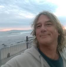 Is the shot going left of the skinny tree?