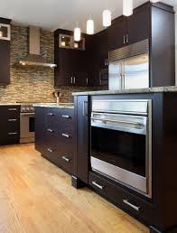 Ample storage drawers, a sink, a cooktop and seating for at least two people make it ideal for loft apartments or open concept kitchens. Kitchen Remodeling Insights Separating Your Cooktop From Your Oven Normandy Remodeling