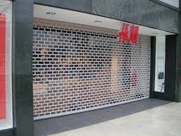 Advantages Of Adding Shop Roller Shutters To A Shop Garage Door Design Roller Shutters Steel Doors