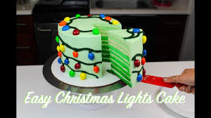 The background is metallic aquamarine. Easy M Ms Christmas Lights Cake Chelsweets Youtube