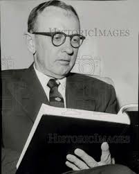 1955 Press Photo Engineer Mason Graves Lockwood studies map book.