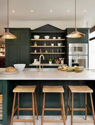 This kitchen island is accented with beautiful classic green cabinets and lighting fixtures.source. Decorate With Dark Green To Create Cozy Rooms Town Country Living