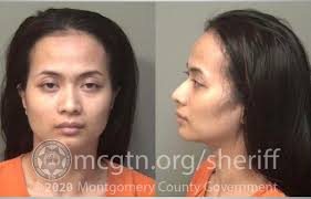 Woman charged with killing husband after security video showed her carrying  gun