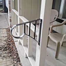 While keeping one rail post on the step (⇓), raise the other rail post off the mounting surface (⇑) until the level reads plumb. New Wrought Iron Metal 1 2 Step Handrail Steel Stair Safety Grab Rail Post Mount Diy Exterior Handrail Iron Handrails Handrail