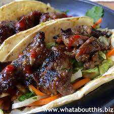 On the grilled tortillas, pile some korean slaw, dressing, beef, reserved and reduced marinade and extra sriracha to taste. Korean Bulgogi Taco Recipe What About This
