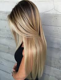 For example, if your hair is naturally dark, but you want an ashy blonde you will need to lighten the hair more and then tone it darker, adding the ash into it. Long Golden Blonde Balayage With Dark Roots Hair Styles Hair Color Balayage Long Hair Styles