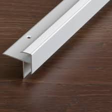 After installing laminate flooring planks, you may notice tiny gaps around the floor edges, directly below the wall trim. Anodized Aluminum Edge Trim Prostep Proline For Tiles Stair Nosing