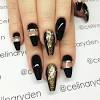 Black and gold nail art with glitter gradient effect. 1